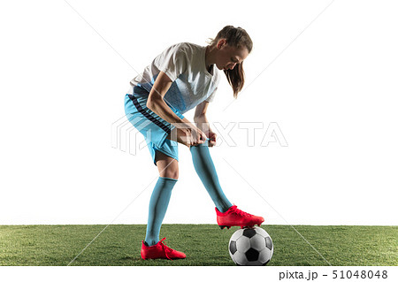 Female soccer player preparing for the game isolated over white background Female soccer player preparing for the game isolated over white background 51048048