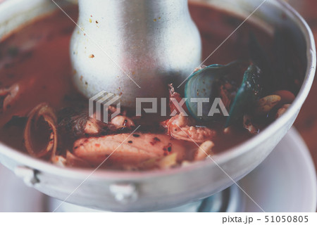 Prawn seafood spicy soup (Tom Yum Goong) at market 51050805