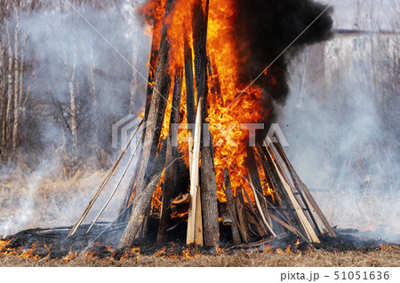 Bonfire of wooden boards and car tires, flame 51051636