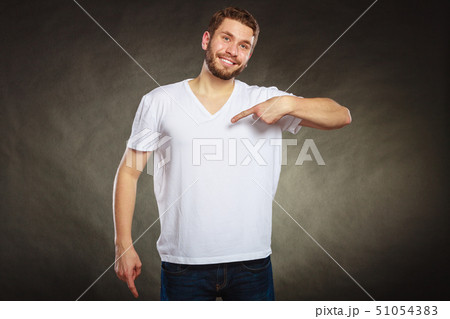 Man guy in blank shirt with copy space pointing. 51054383