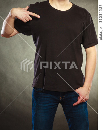 Man guy in blank shirt with copy space pointing. 51054388