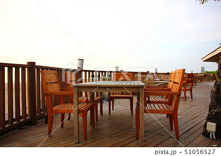 wooden table and desk on beach at sea view 51056527