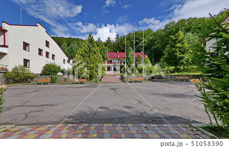 asphalt playground with benches for rest on the ba 51058390