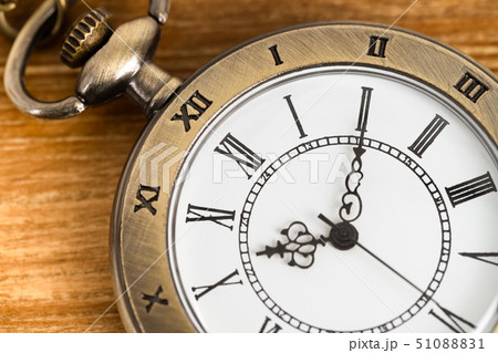 Vintage pocket watch clock on wooden background Vintage pocket watch clock on wooden background 51088831