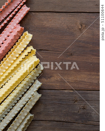 Tricolor mafalde pasta on the wood 51100644