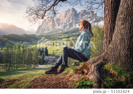 Young woman in sunglasses and blue jacket 51102824