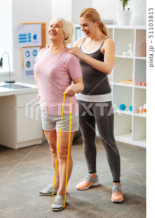Joyful elderly woman holding a rubber band Joyful elderly woman holding a rubber band 51103815