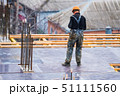 Back view construction site worker in helmet 51111560