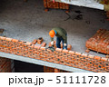 View of mason laying bricks at construction site 51111728