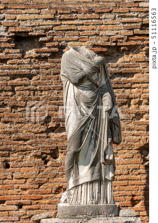 Roman statue with toga - Ostia Antica Rome Italy Roman statue with toga - Ostia Antica Rome Italy 51116563