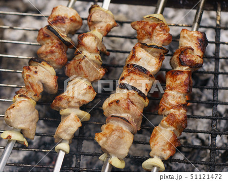 Cooking shish kebabs on the grill on the coals Cooking shish kebabs on the grill on the coals 51121472