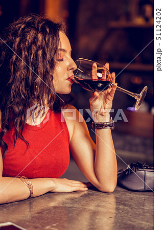 Girlfriend drinking wine alone while waiting for her man Girlfriend drinking wine alone while waiting for her man 51124202