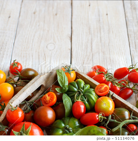 Colorful tomatoes on a wooden table 51134076