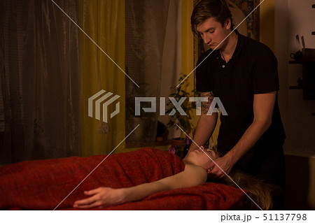 Spa facial massage for woman client 51137798