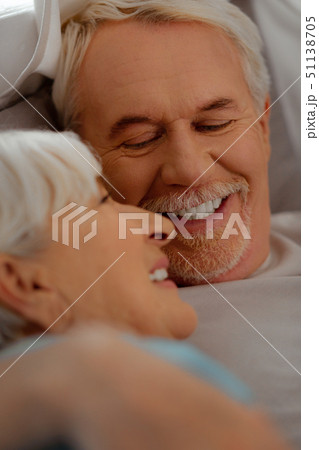 Face-portrait of white-haired vigorous man looking at silver-haired beautiful wife Face-portrait of white-haired vigorous man looking at silver-haired beautiful wife 51138705