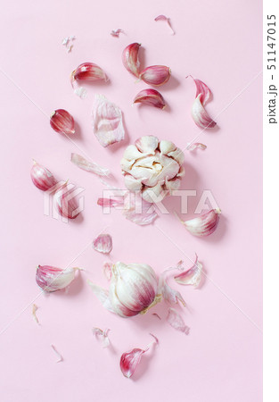 Fresh garlic on a light pink background 51147015
