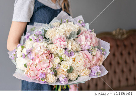 Large Beautiful bouquet of mixed flowers in woman hand. Floral shop concept . Beautiful fresh cut 51186931
