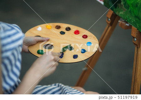 Palette with paints and spatula. Drawing a picture Palette with paints and spatula. Drawing a picture 51197919