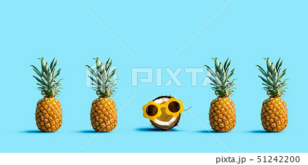One out unique coconut with many pineapples One out unique coconut with many pineapples 51242200