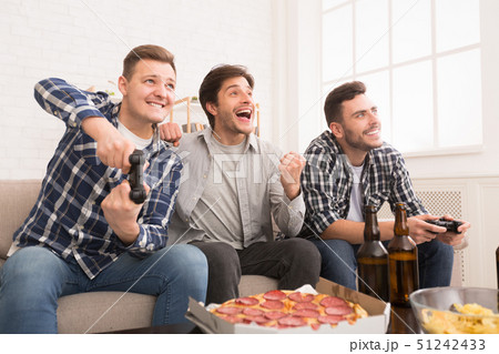 Avid Gamers. Friends Playing Video Games, Resting At Home Avid Gamers. Friends Playing Video Games, Resting At Home 51242433