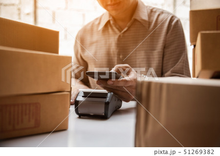 Man hand holding credit card reader nfc tecnology 51269382