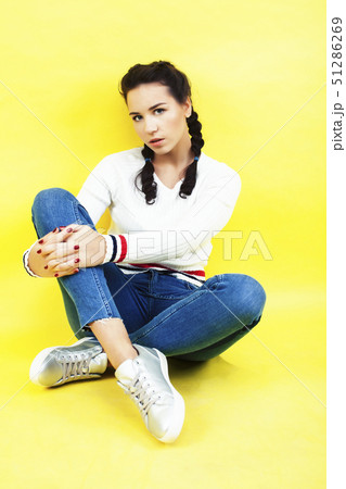 lifestyle people concept: pretty young school teenage girl having fun happy smiling on yellow lifestyle people concept: pretty young school teenage girl having fun happy smiling on yellow 51286269