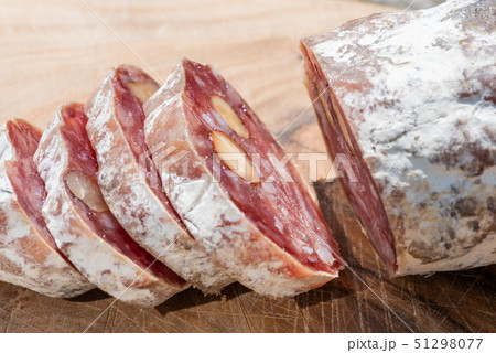 Dried sausage with nuts cut in slices Dried sausage with nuts cut in slices 51298077