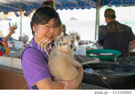 Thai woman shopping a seafood in market Thai woman shopping a seafood in market 51330860