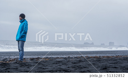 Asina advanture man  at Iceland black beach with 51332852