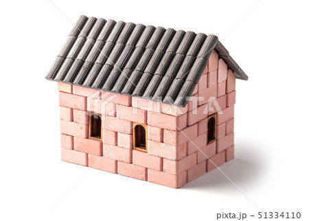 Brick house on a white background. Model toy at home Brick house on a white background. Model toy at home 51334110