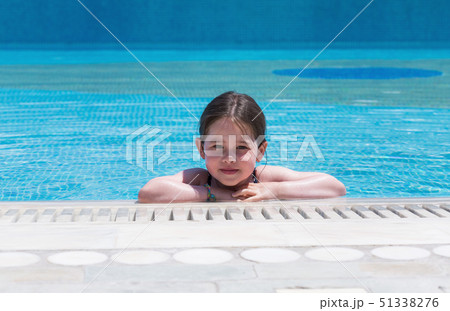 Little cute girl swimming in a pool 51338276