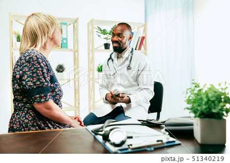 A senior woman visiting a therapist at the clinic 51340219