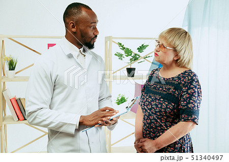 A senior woman visiting a therapist at the clinic A senior woman visiting a therapist at the clinic 51340497