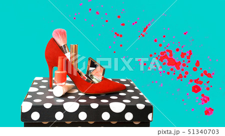 Trendy outfit layout red shoes accessories makeup cosmetics on black and white box and blue 51340703
