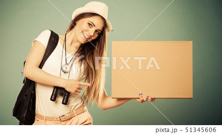 Summer traveler woman hitchhiking with blank sign Summer traveler woman hitchhiking with blank sign 51345606