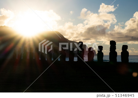 Bright sun rising behind Moai silhouettes in Easter Island 51346945