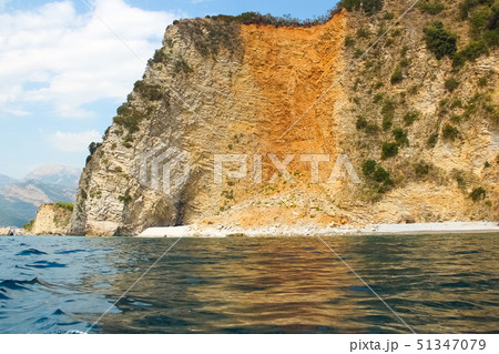 The rocks over the transparent ocean water. Montenegro The rocks over the transparent ocean water. Montenegro 51347079