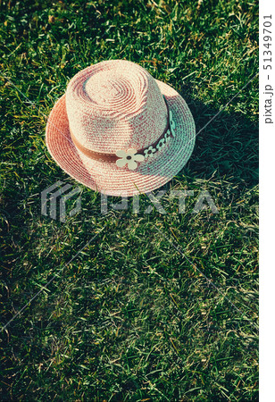 Summer background Pink sunhat on grass. Pop art design, creative Minimalism. 51349701