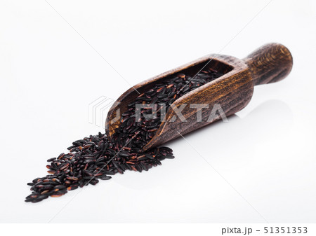 Wooden spoon of raw organic black venus rice on 51351353