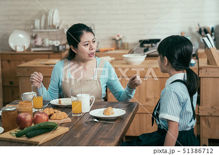 frowning angry mom loudly nag at daughter frowning angry mom loudly nag at daughter 51386712