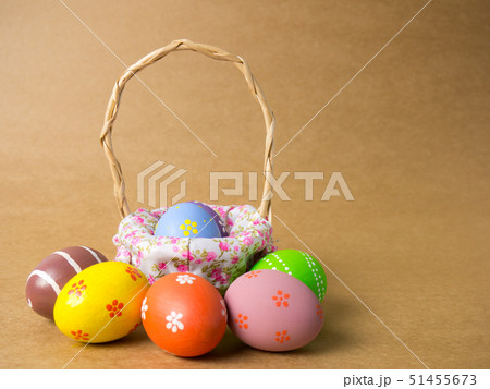 Easter eggs in a basket weave wood on the left 51455673