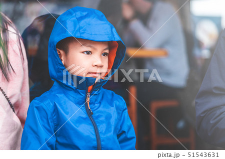 Portrait of Asian kid boy in blue winter clothing. 51543631
