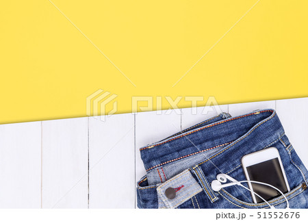 Phone and music earphone in Jean pocket with white Phone and music earphone in Jean pocket with white 51552676