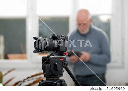 close-up of a camera on  tripod, photographer 51605969