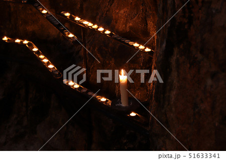 Burning candle in the Temppeliaukion Church. 51633341