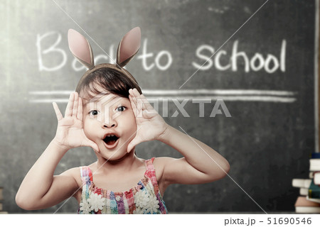 Asian student girl with funny expression 51690546