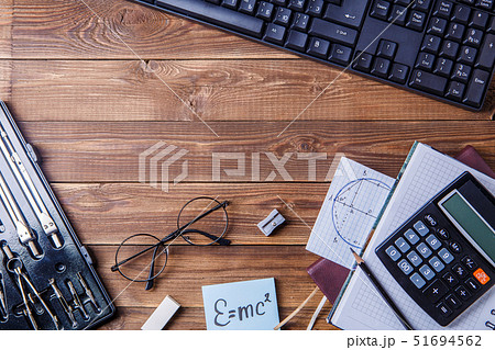 Student material on wooden table with copyspace. Student material on wooden table with copyspace. 51694562