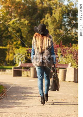 Back view of stylish woman on air 51720969