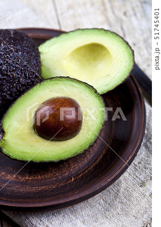 Fresh organic avocado on ceramic plate and linen 51745401