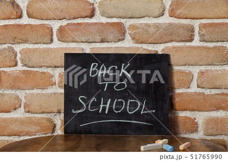 Black chalkboard with the phrase BACK TO SCHOOL 51765990